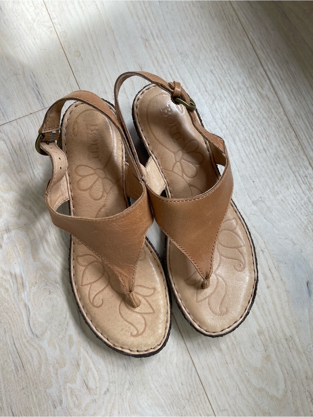 Born tan leather thongs on short heal size 6.